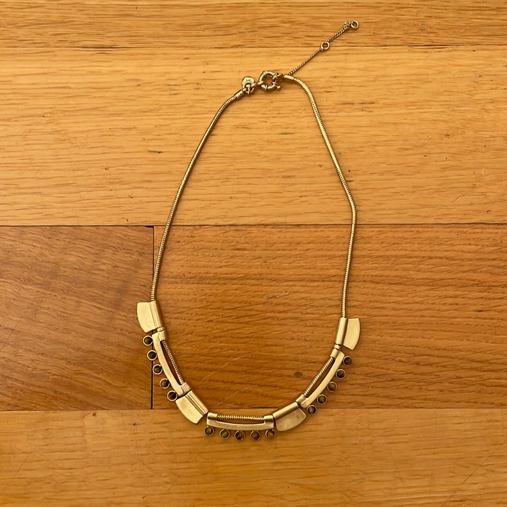 Accent necklace with adjustable chain.